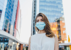 portrait of young woman with mask for protection from coronavirus outbreak